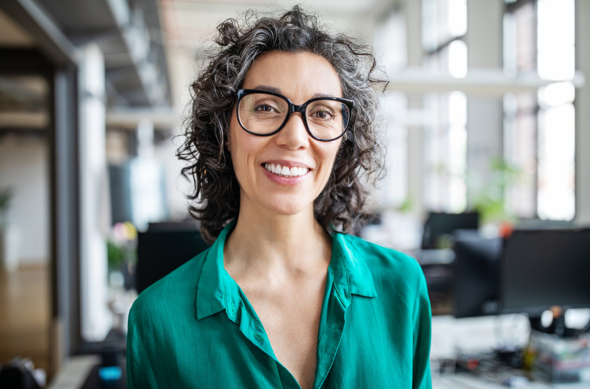 Close-up of a smiling higher ed professional