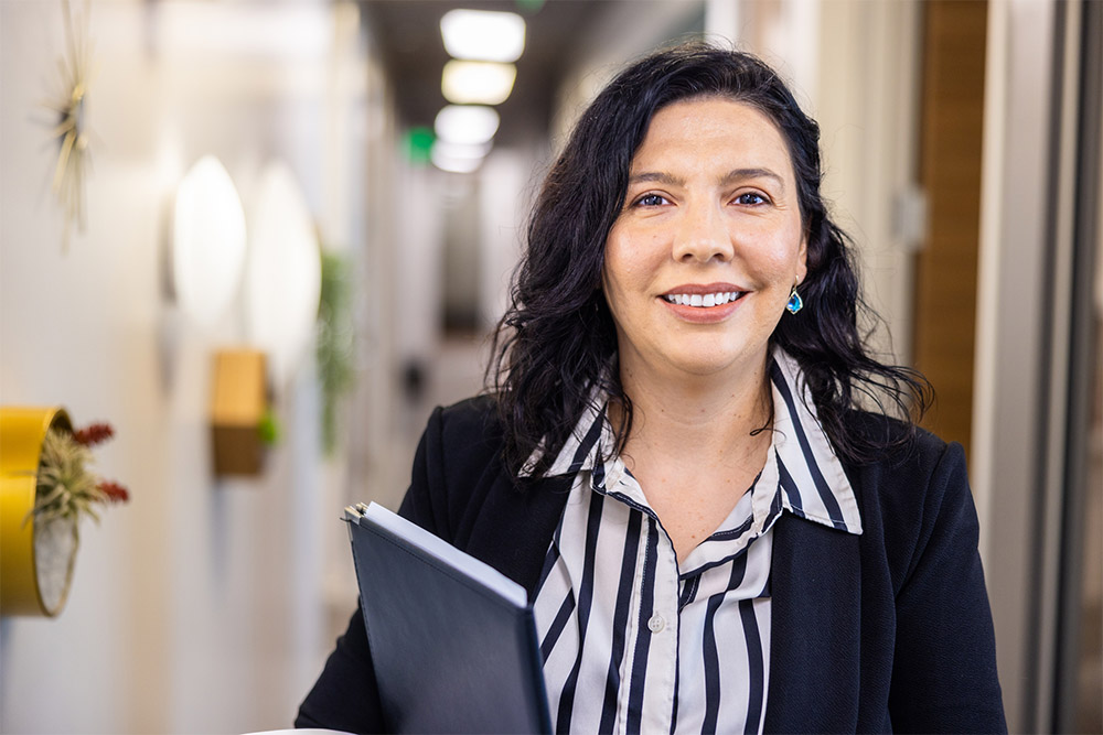 Latino professional smiling at camera