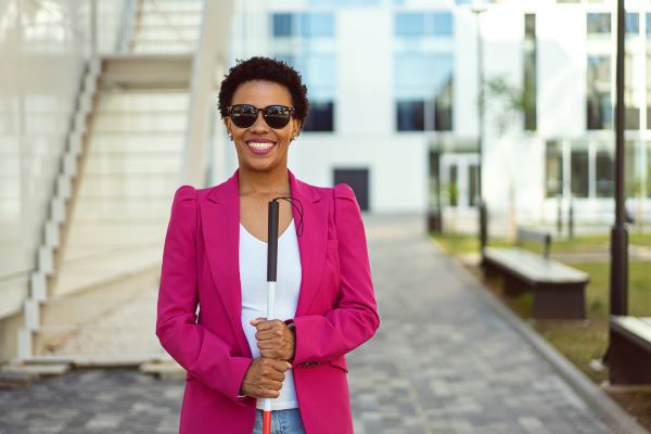 Professional with disability smiling at camera